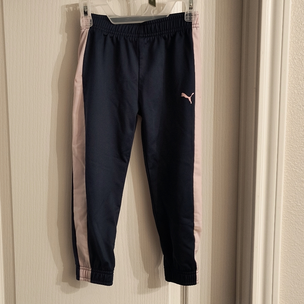 Puma girl pants size 5 all blue with light pinkish stripes on both sides.